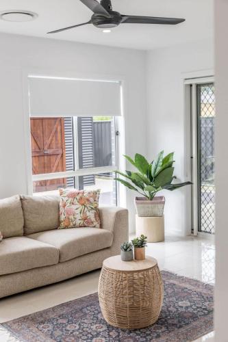 a living room with a couch and a coffee table at Lavender & Olive in Myrtleford