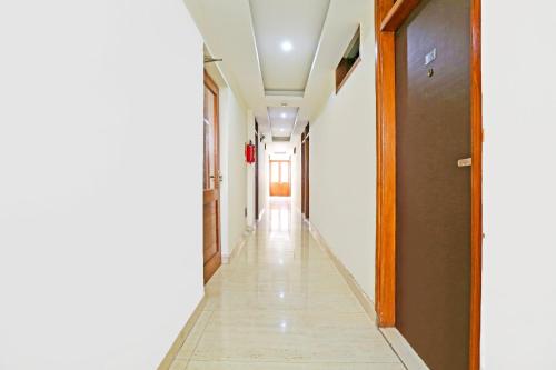 a corridor of an empty room with a hallway at Super Hotel O Gurgaon Old Town in Gurgaon