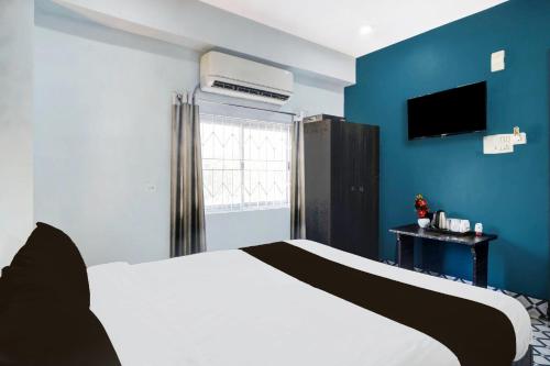 Postel nebo postele na pokoji v ubytování Hotel O Noonmati Guwahati Formerly Hotel Sundari