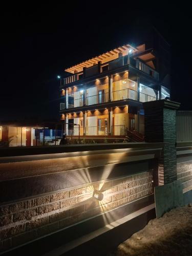 a building at night with its lights on at Little Hearts recidency in Āvadi