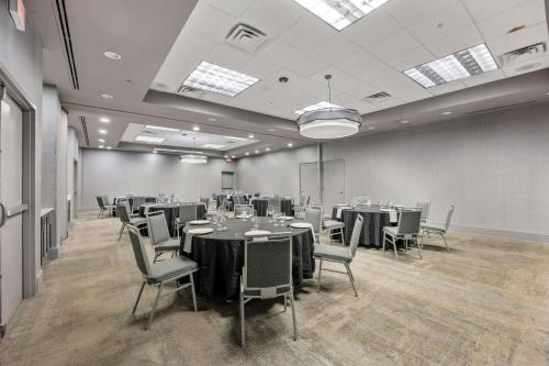 a conference room with tables and chairs in it at DoubleTree Suites by Hilton Hotel Huntsville South in Huntsville