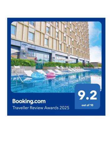 a picture of a hotel with a swimming pool at Hotel Collective in Naha