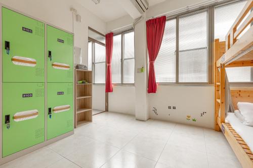 a bedroom with two bunk beds and red curtains at Forever Happiness Hostel in Puli
