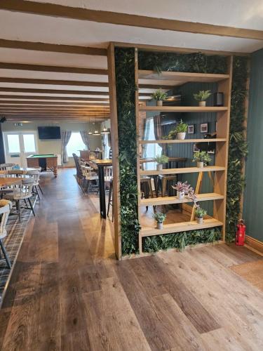 a room with a wall covered in plants at Static 19 in Llandysul