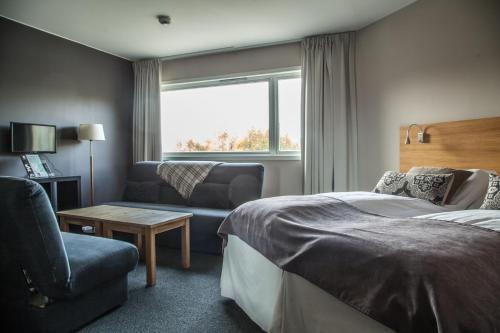Uma cama ou camas num quarto em Sirdal Høyfjellshotell