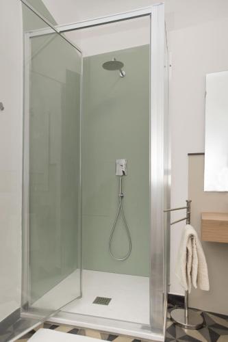 a shower with a glass enclosure in a bathroom at Ca' Mati in Imperia