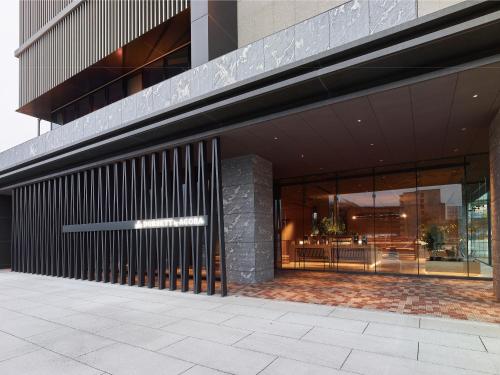 an external view of a building with large windows at Dorsett by Agora Osaka Sakai in Sakai
