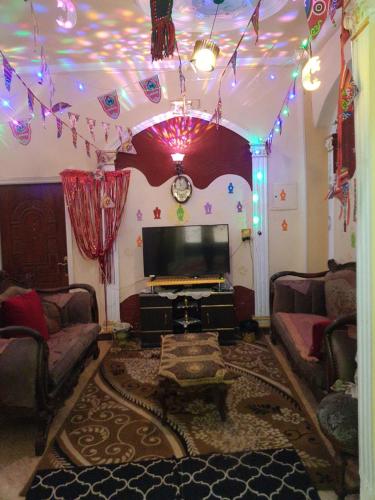 TV a/nebo společenská místnost v ubytování Mego pyramids view inn
