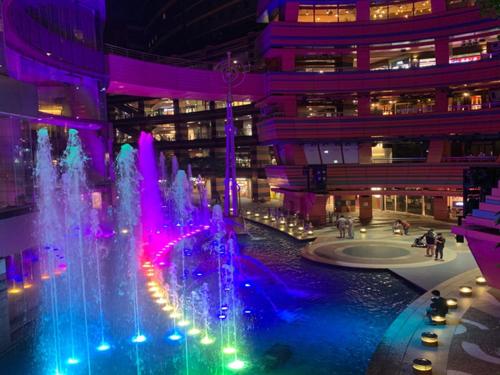 a fountain in front of a building with colorful lights at Canal City Fukuoka Washington Hotel in Fukuoka