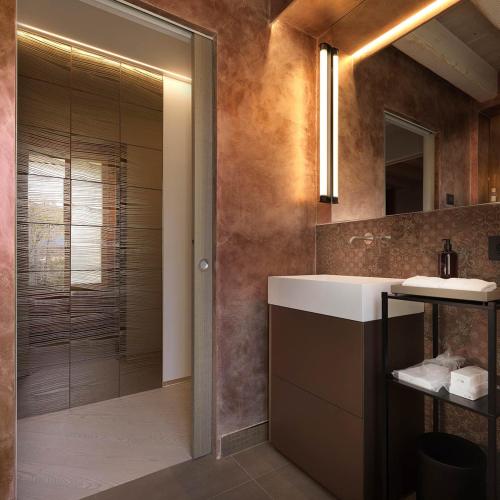 a bathroom with a sink and a shower at Ca' Apollonio Heritage in Romano D'Ezzelino