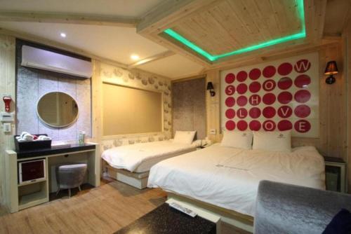 Ένα ή περισσότερα κρεβάτια σε δωμάτιο στο Show Hotel Haeundae