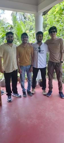 a group of four men standing next to each other at Sigiriya Moonlight Home in Sigiriya