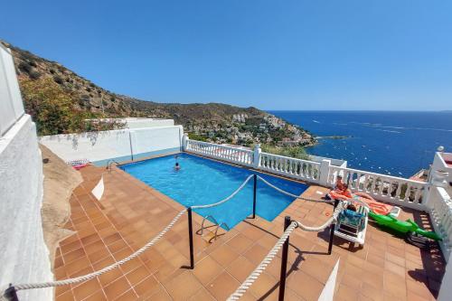 a swimming pool on a balcony with a view of the ocean at Ibiza Bramer 7 - ImmoBarneda in Roses