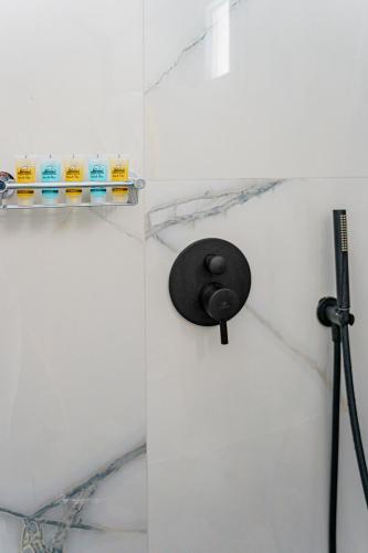 a black object on a wall in a bathroom at Zana's Villa-Sandra in Akrotiri