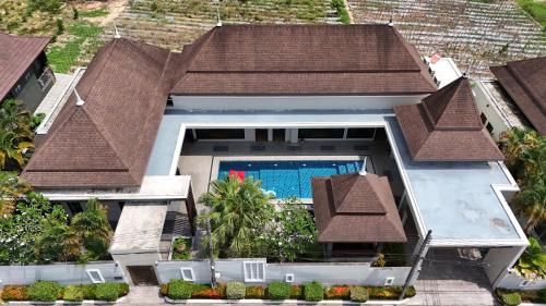 an aerial view of a house with a swimming pool at Narintara Private Pool Villas - Free Tuk-Tuk Service to the Beach! in Ao Nang Beach