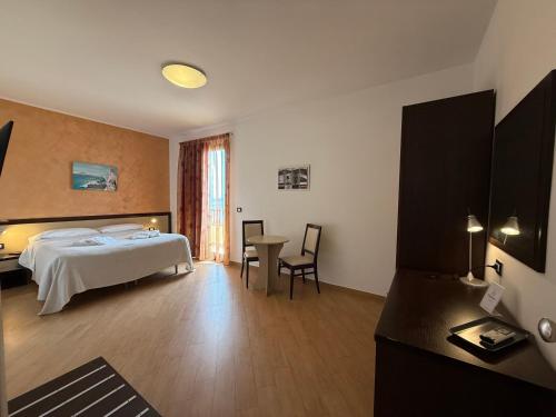 Cama o camas de una habitación en Albergo Perseo