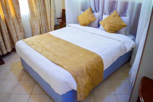Postelja oz. postelje v sobi nastanitve Anthena Hotel