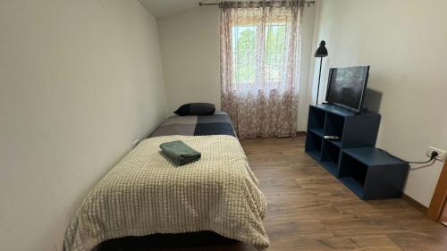 Postel nebo postele na pokoji v ubytování GuestHouse Flora