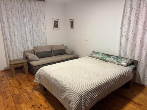 Postel nebo postele na pokoji v ubytování GuestHouse Flora