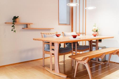 a wooden table and chairs in a room at Solvana Akasaka in Tokyo