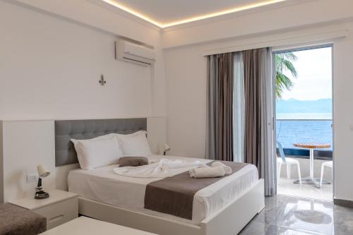 Ένα ή περισσότερα κρεβάτια σε δωμάτιο στο Vila Era Beach