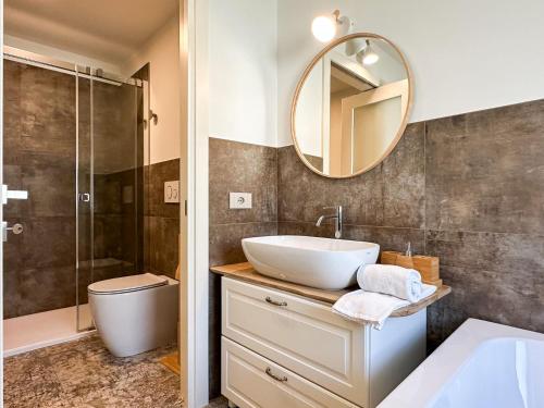 a bathroom with a sink and a mirror at Sogni di Paglia - Eco Country House in Monforte dʼAlba