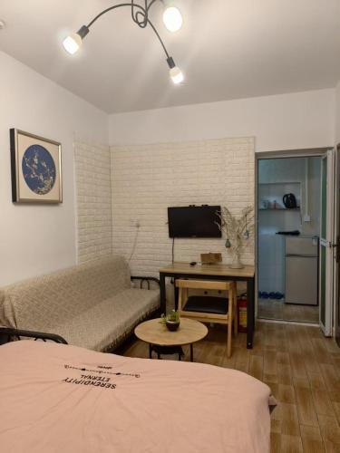 TV a/nebo společenská místnost v ubytování Lin Jiang Apartment