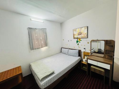 Ένα ή περισσότερα κρεβάτια σε δωμάτιο στο Hava Homestay