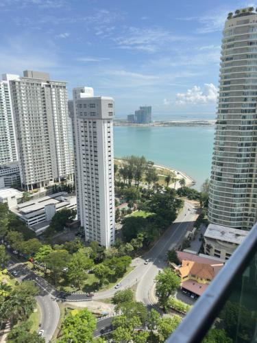 a view of a city and the ocean from a building at HappySty George Town Gurney Mansion one 26 in George Town