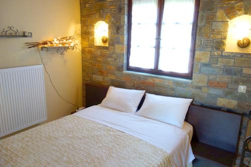 Ένα ή περισσότερα κρεβάτια σε δωμάτιο στο Villa Apanemi