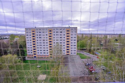 a tall building in the middle of a city at Apartmány Karviná in Karviná