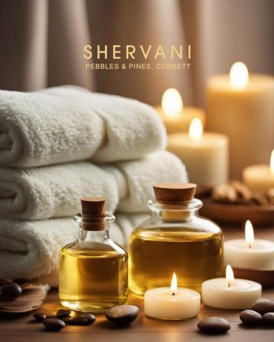 a room with towels and candles and a bottle of honey at Shervani Pebbles & Pines Resort & Spa, Corbett in Rāmnagar