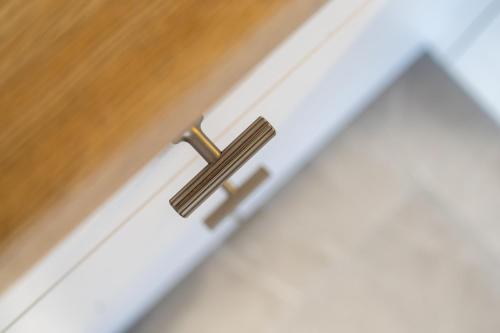 a wooden drawer with a brass door knob at Studio LOFT12 in Kielce