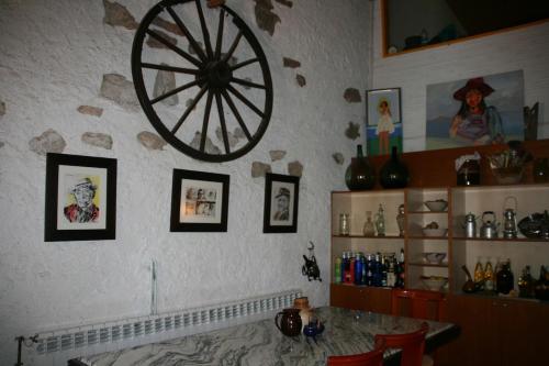 a room with aokedoked wheel on the wall at MASIA CAN SUNYER AGROTURISMO in La Garriga