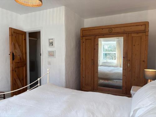 a bedroom with a large bed and a window at Cottage 484 - Moyard in Moyard