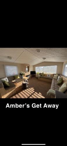 a large living room with couches and avisor at Amber’s Get Away in Skegness