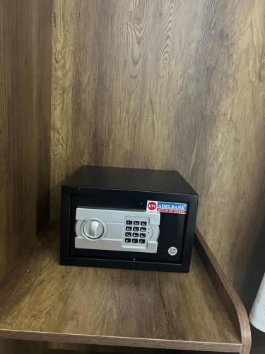 a microwave oven sitting on top of a table at ORCHID Hotel in Da Lat