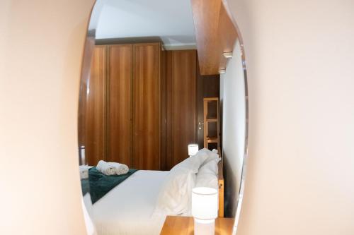 Ένα ή περισσότερα κρεβάτια σε δωμάτιο στο Monte Guglielmo apartment