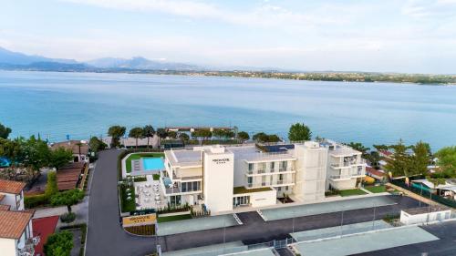 an aerial view of a building next to the water at Vision Hotel in Peschiera del Garda