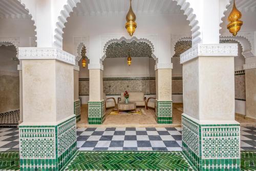 a room with a checkered floor in a mosque at Palais Moulay Said & SPA in Marrakech