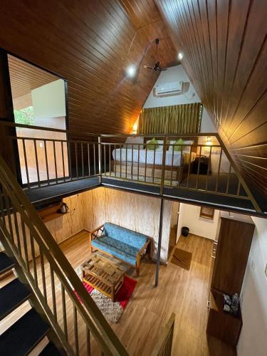 an overhead view of a living room with a staircase at Wild Stories Resort, Munnar in Anachal