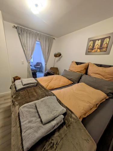 a bedroom with two beds with towels on them at Urlaubsresidenz Schlossblick in Colditz