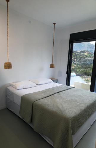 Postel nebo postele na pokoji v ubytování Meraki Villas