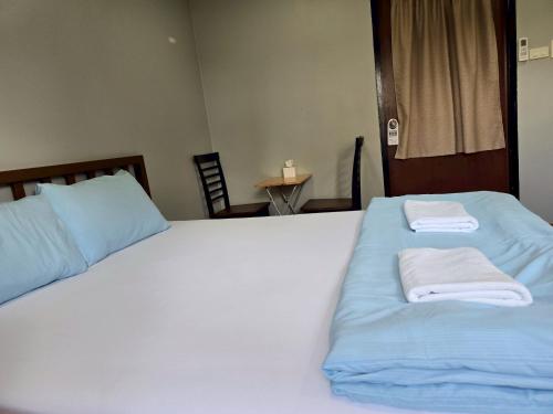 Ein Bett oder Betten in einem Zimmer der Unterkunft Chill @ Phetchaburi