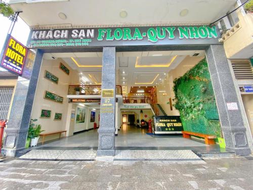 a mall with a sign that reads krish san london owl museum at Flora Quy Nhon Hotel in Quy Nhon