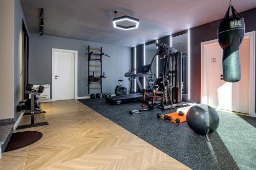 a gym with exercise equipment in a room at Villa Arthur in Kassiopi