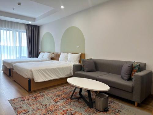 Giường trong phòng chung tại TMS Quy Nhơn Luxury Homestay