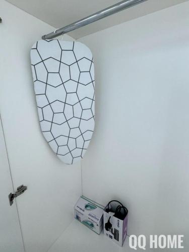 a mirror on a wall in a bathroom with a box at Nice Seaview Water Front Apartment 3R3B 超舒适海景房间-3房3卫 in Port Dickson