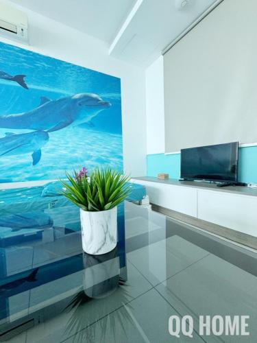 a living room with a dolphin mural on the wall at Nice Seaview Water Front Apartment 3R3B 超舒适海景房间-3房3卫 in Port Dickson