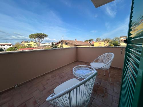 a balcony with two chairs and a view at Casa Vacanze Mary Jane House in Fiumicino
